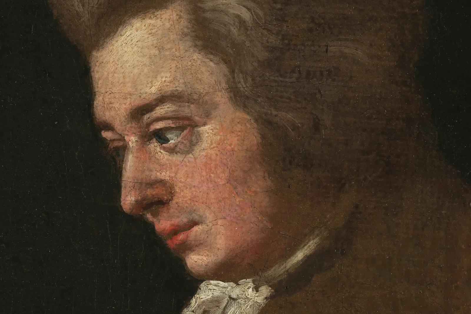 Unvollendetes Porträt von Wolfgang Amadeus Mozart, gemalt von Joseph Lange, sein Gesicht im Profil vor dunklem Hintergrund